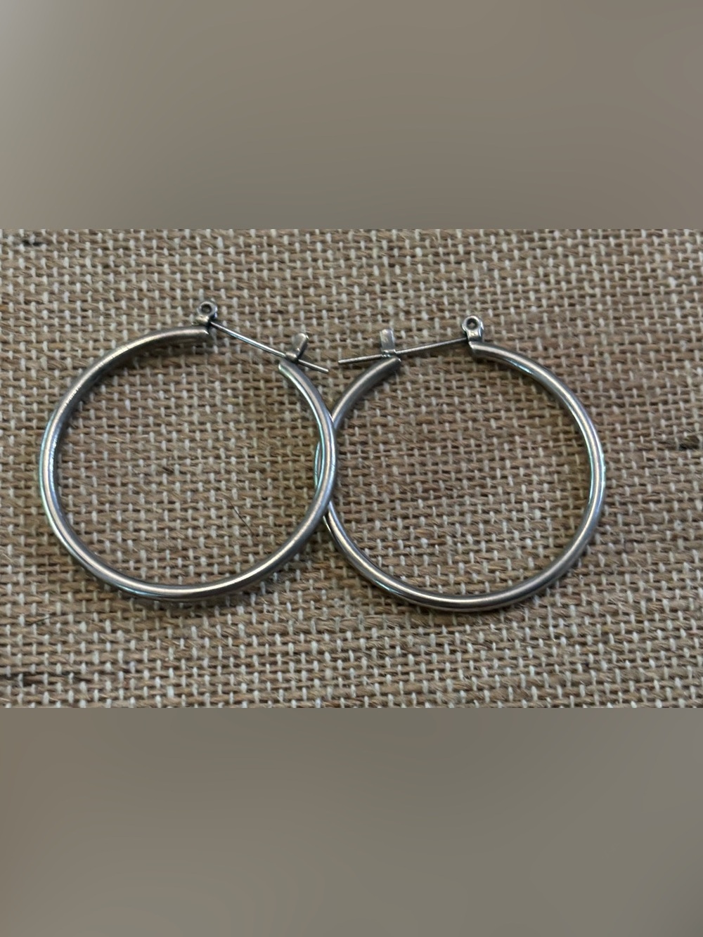 Silver tone hoop earrings